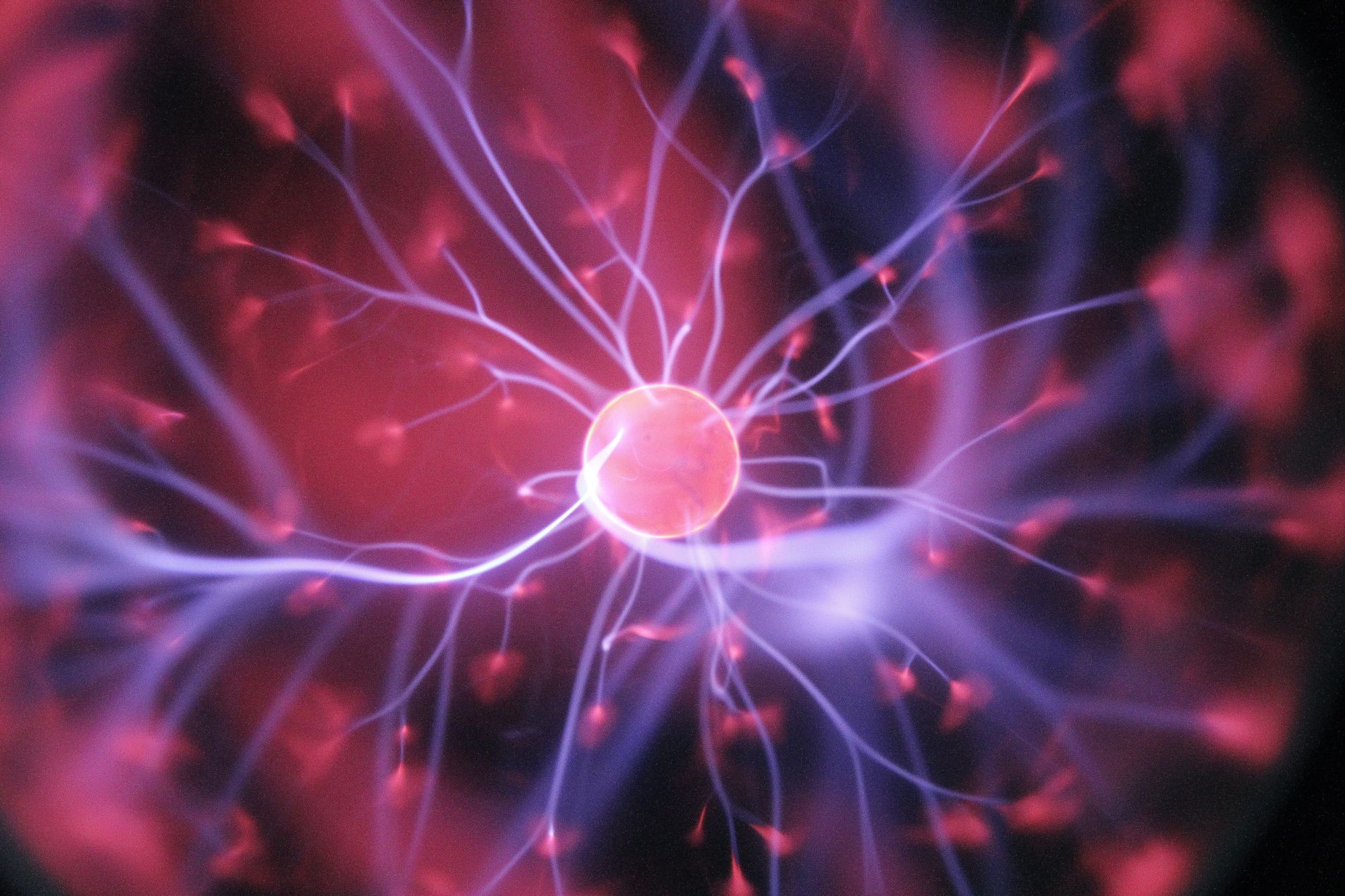 Electrical impulses in brain neurones.